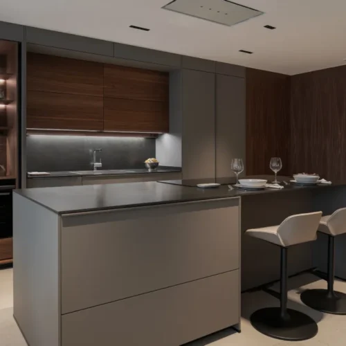 Cocina abierta al salón en gris visón y nogal